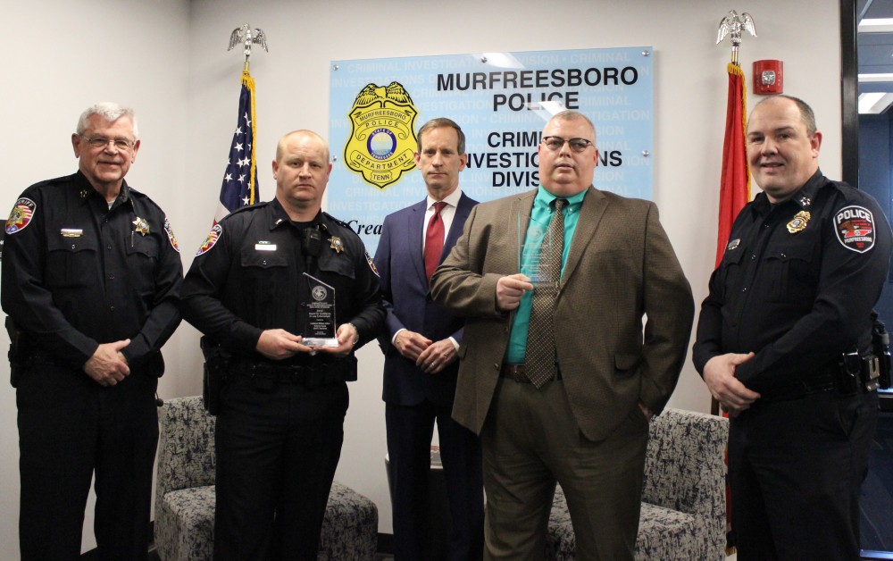 U.S. Attorney presents awards to 2 officers who investigated opioid deaths, injuries